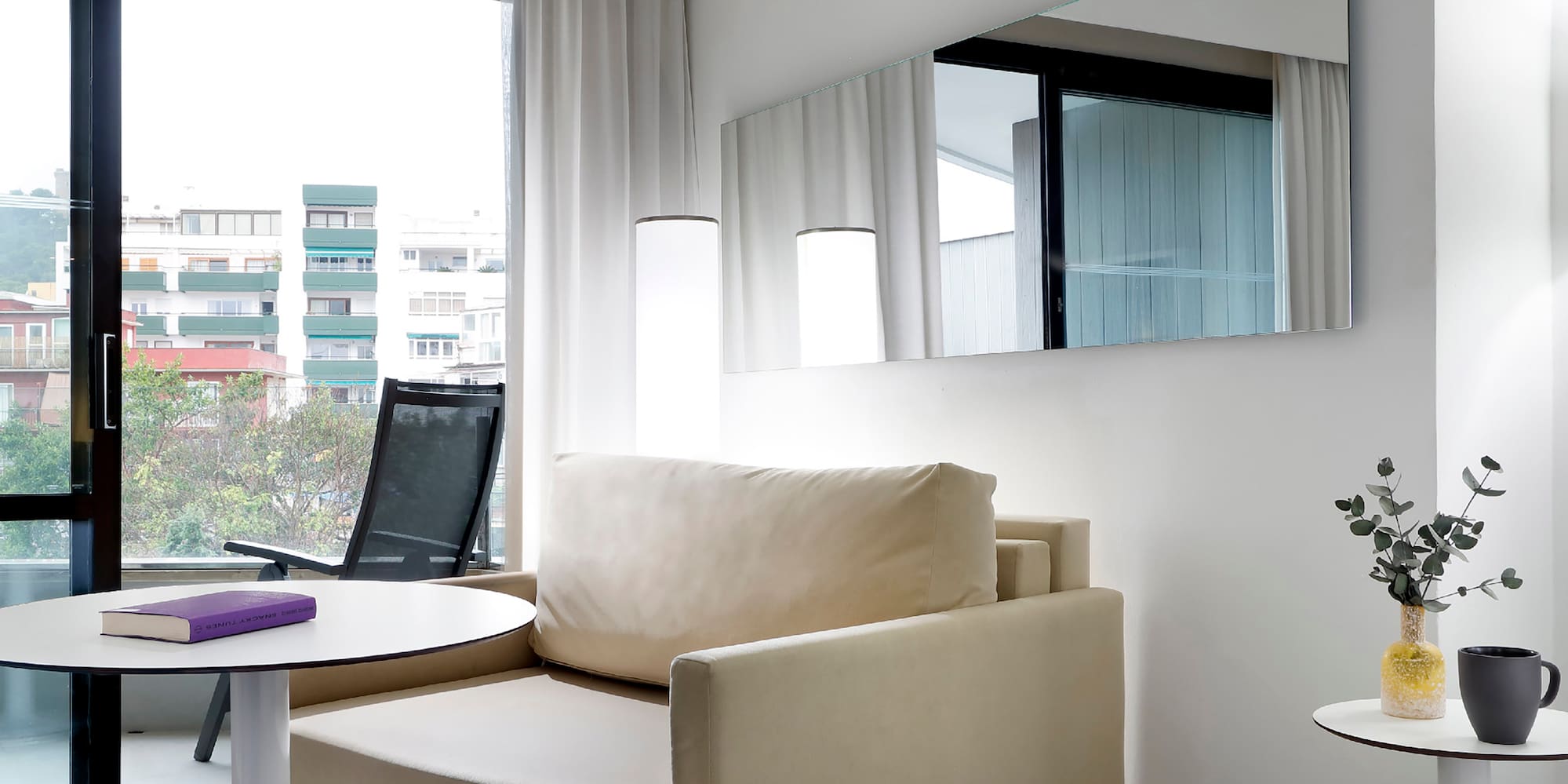 a room with a bed and a chair