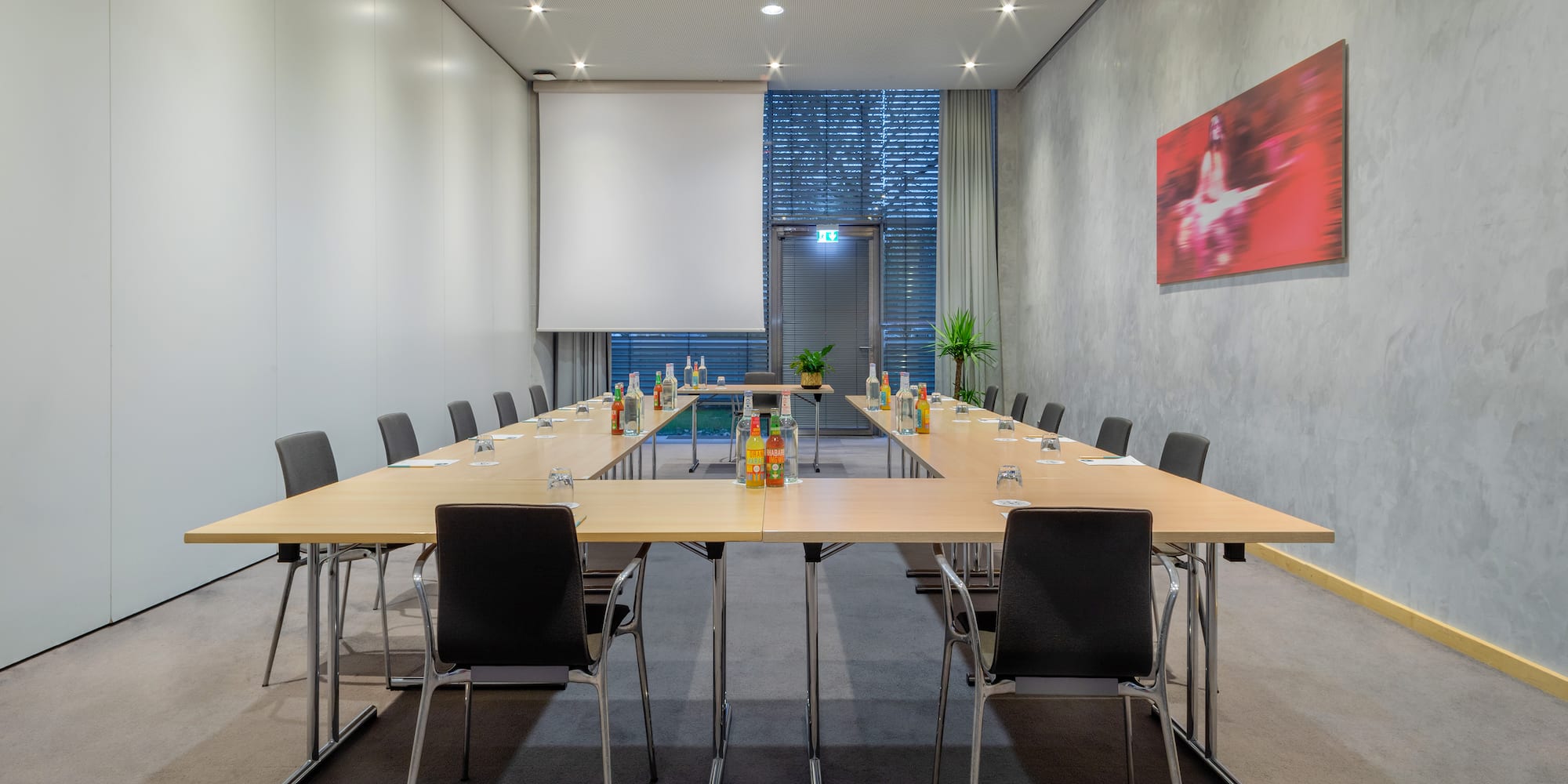 a conference room with a table and chairs