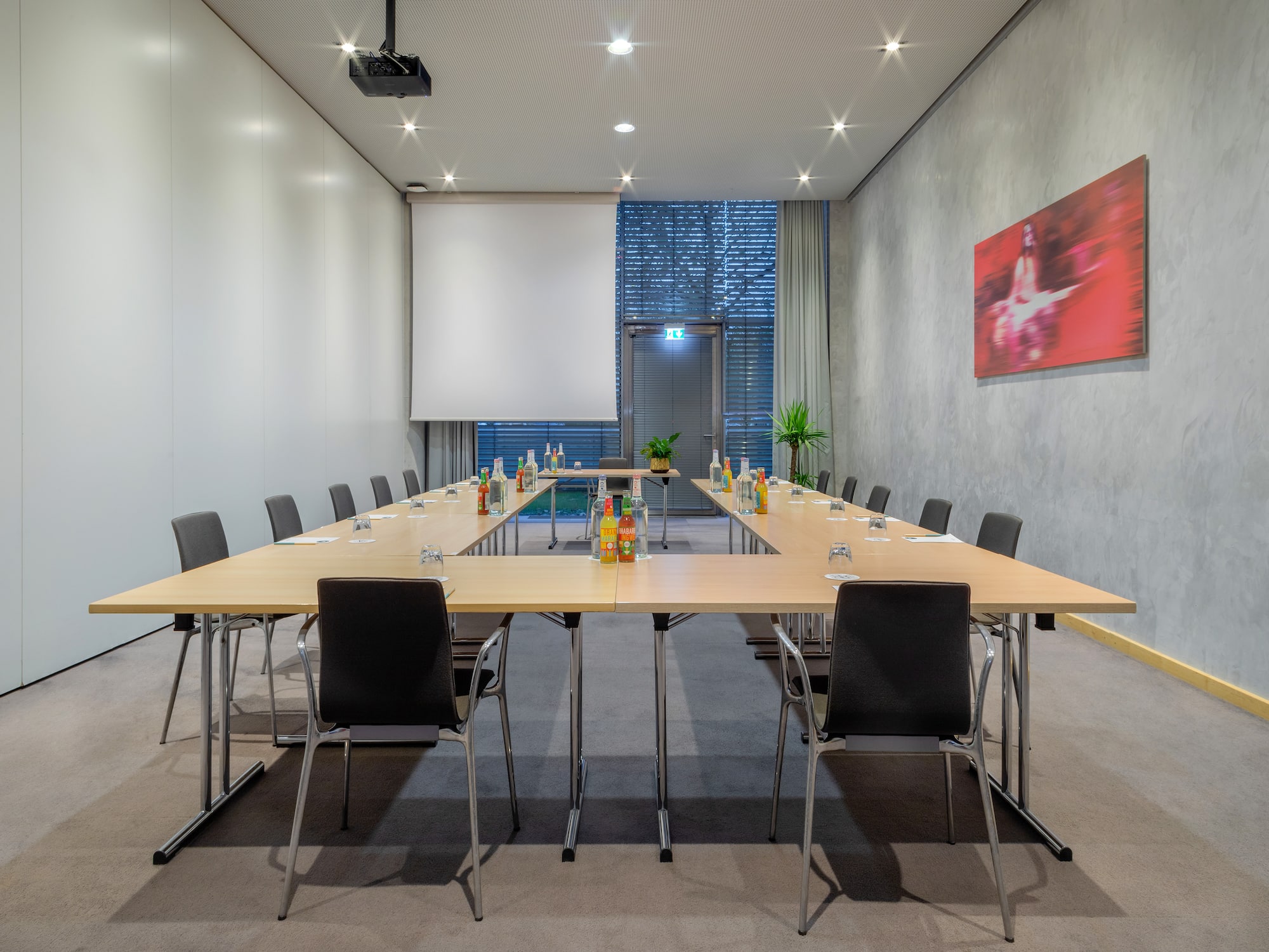 a conference room with a table and chairs