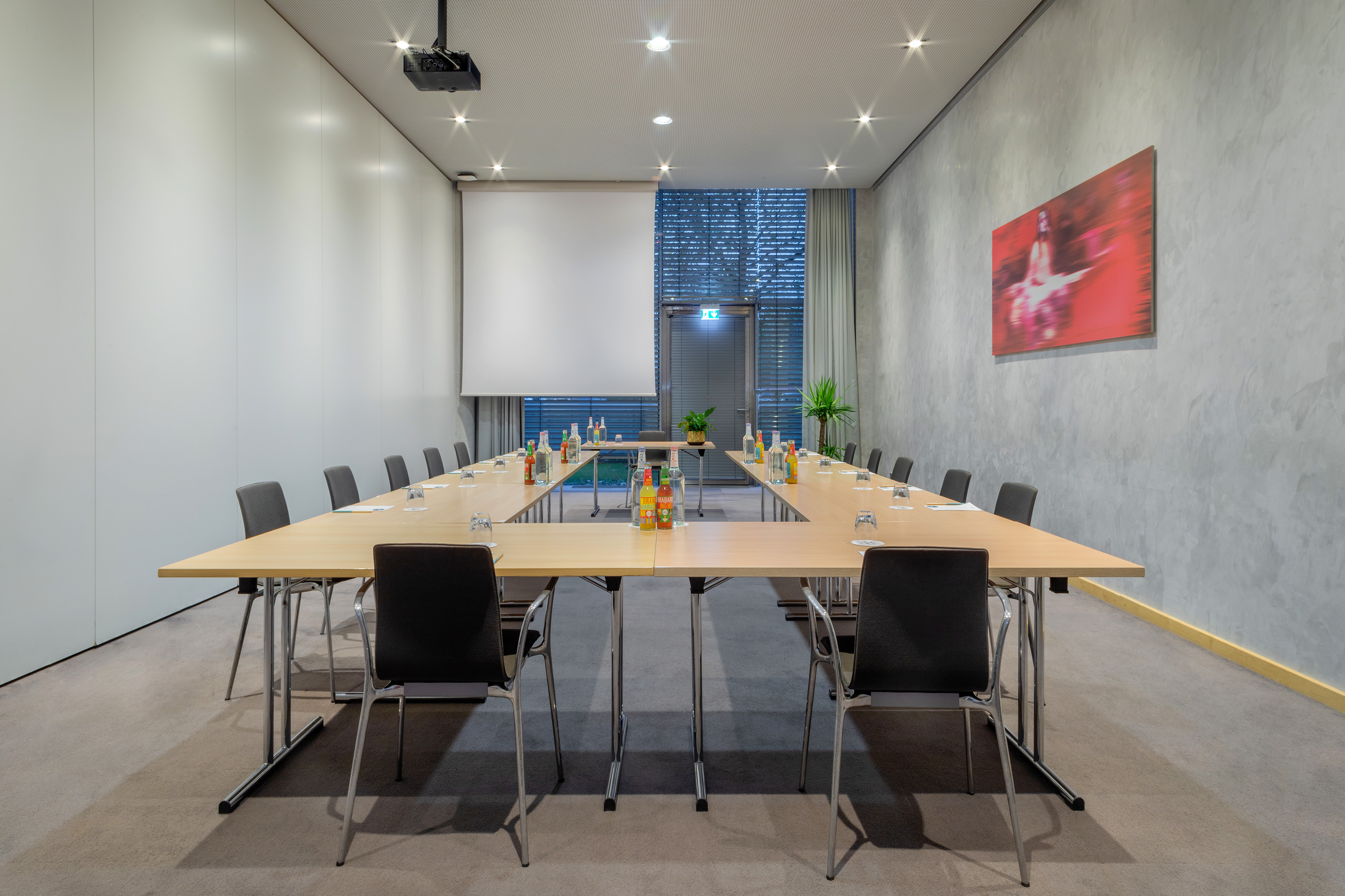 a conference room with a table and chairs