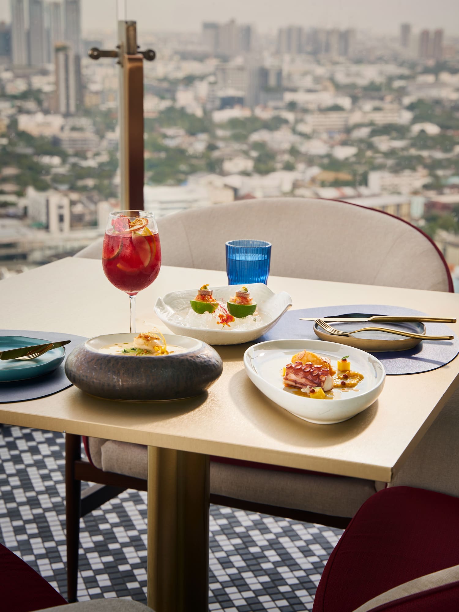 a table with plates of food and a drink on it
