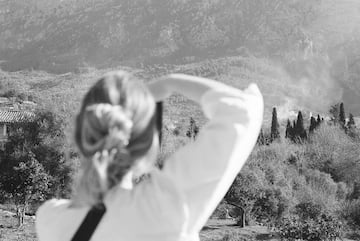 a woman looking at a mountain