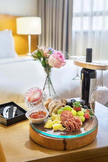 a plate of food and wine on a table