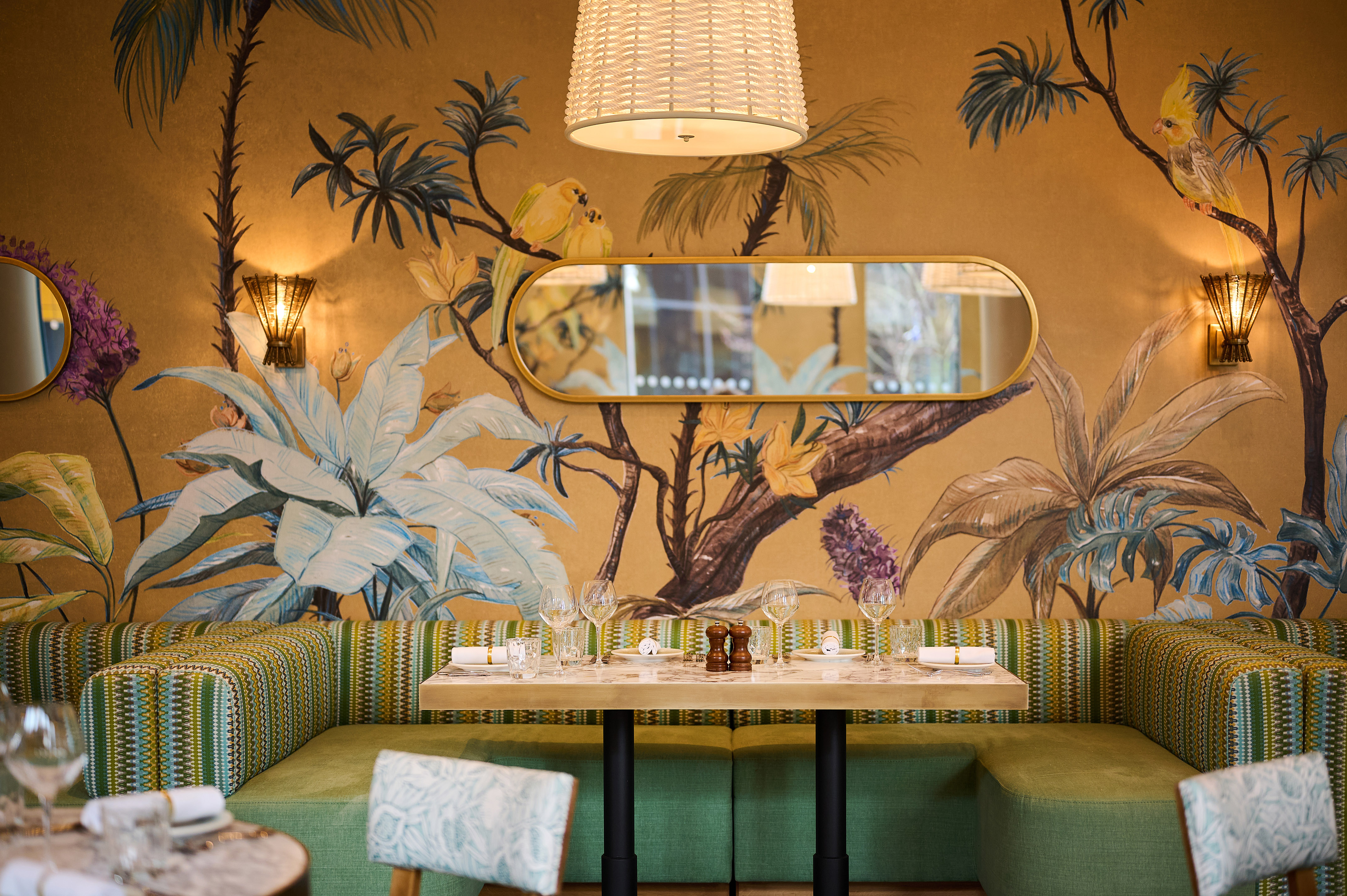 a table with a mirror and a wallpaper