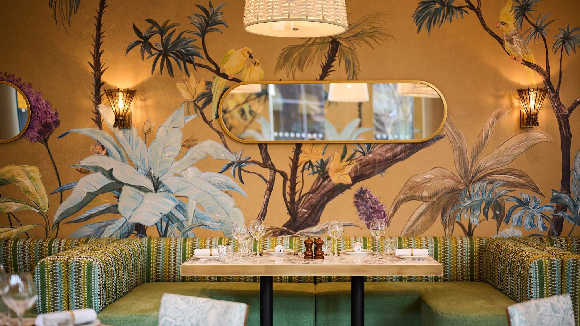 a table with a mirror and a wallpaper