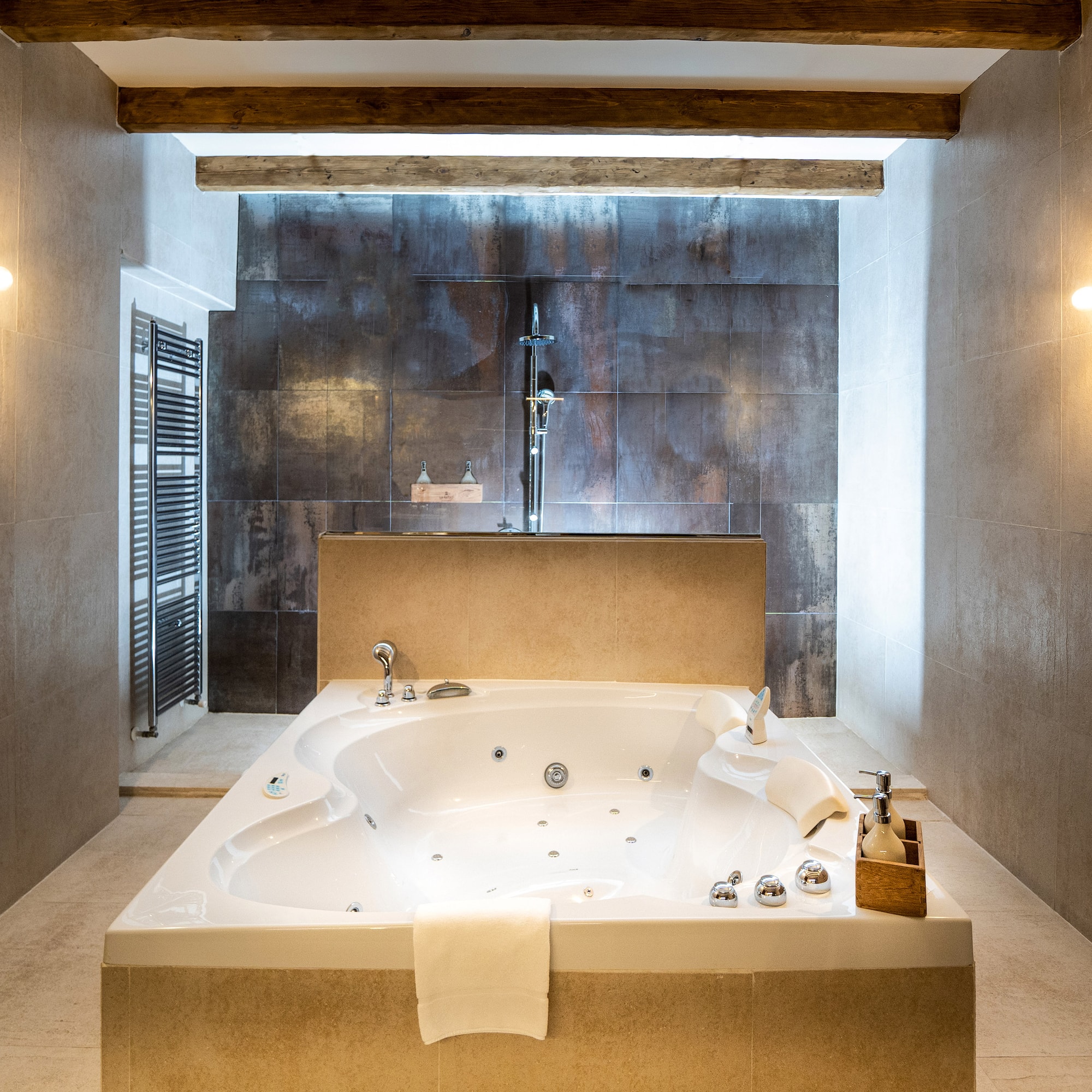 a large white bathtub in a bathroom