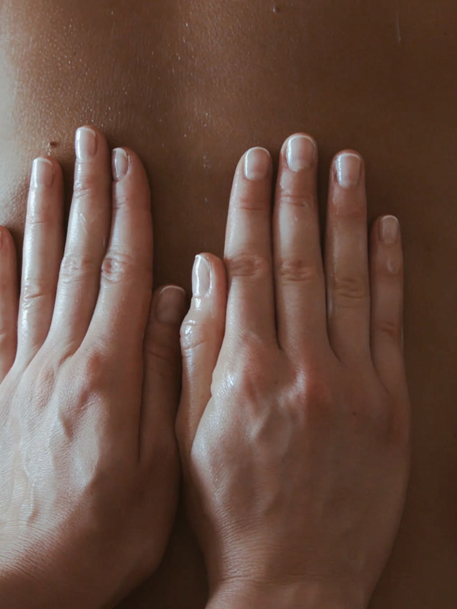 hands on a person's back