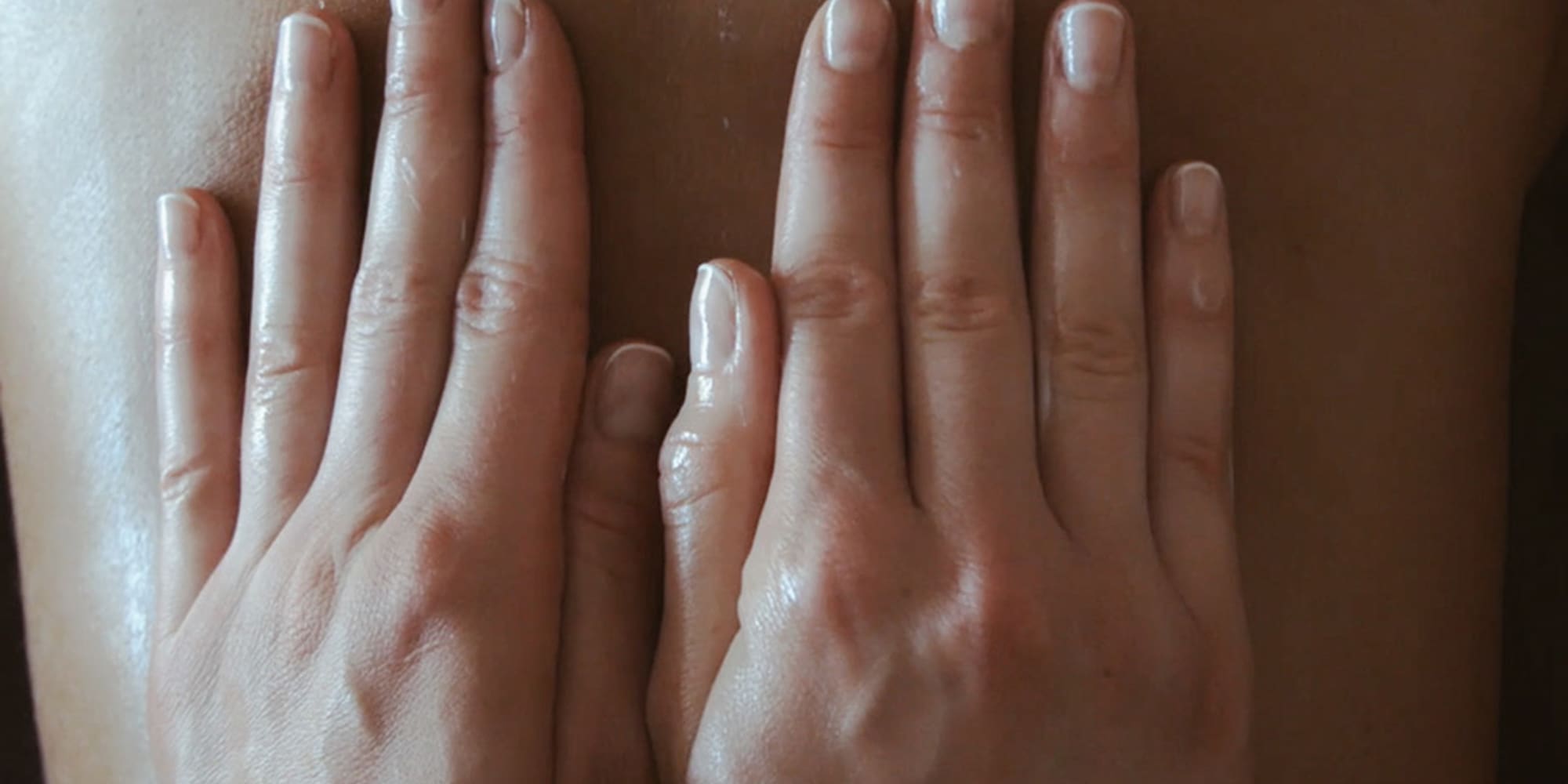 hands on a person's back