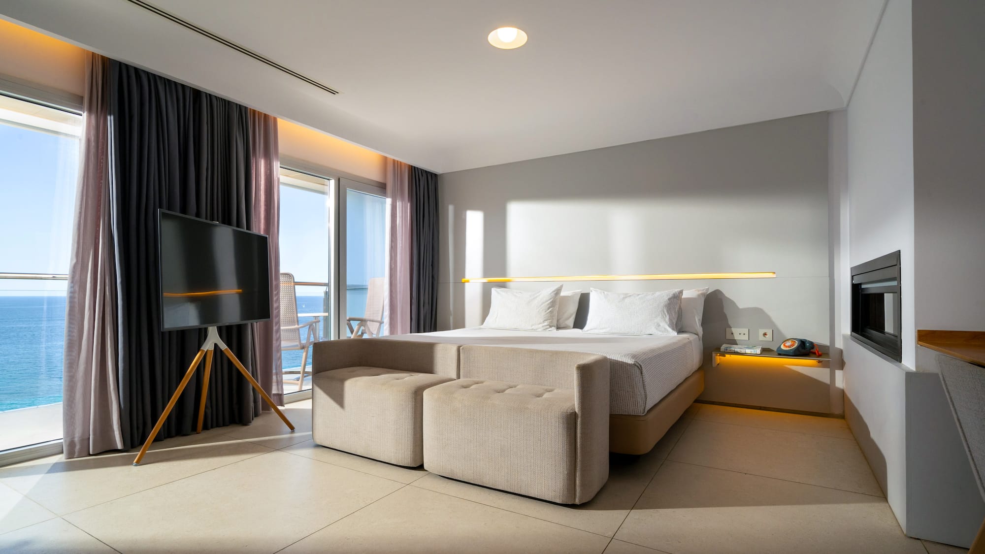 a room with a bed and a television