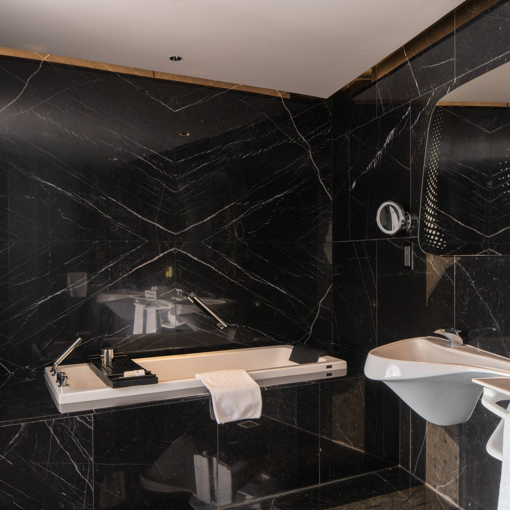 a bathroom with a sink and mirror