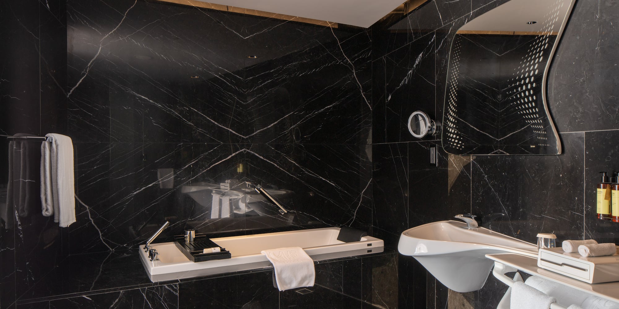 a bathroom with a sink and mirror