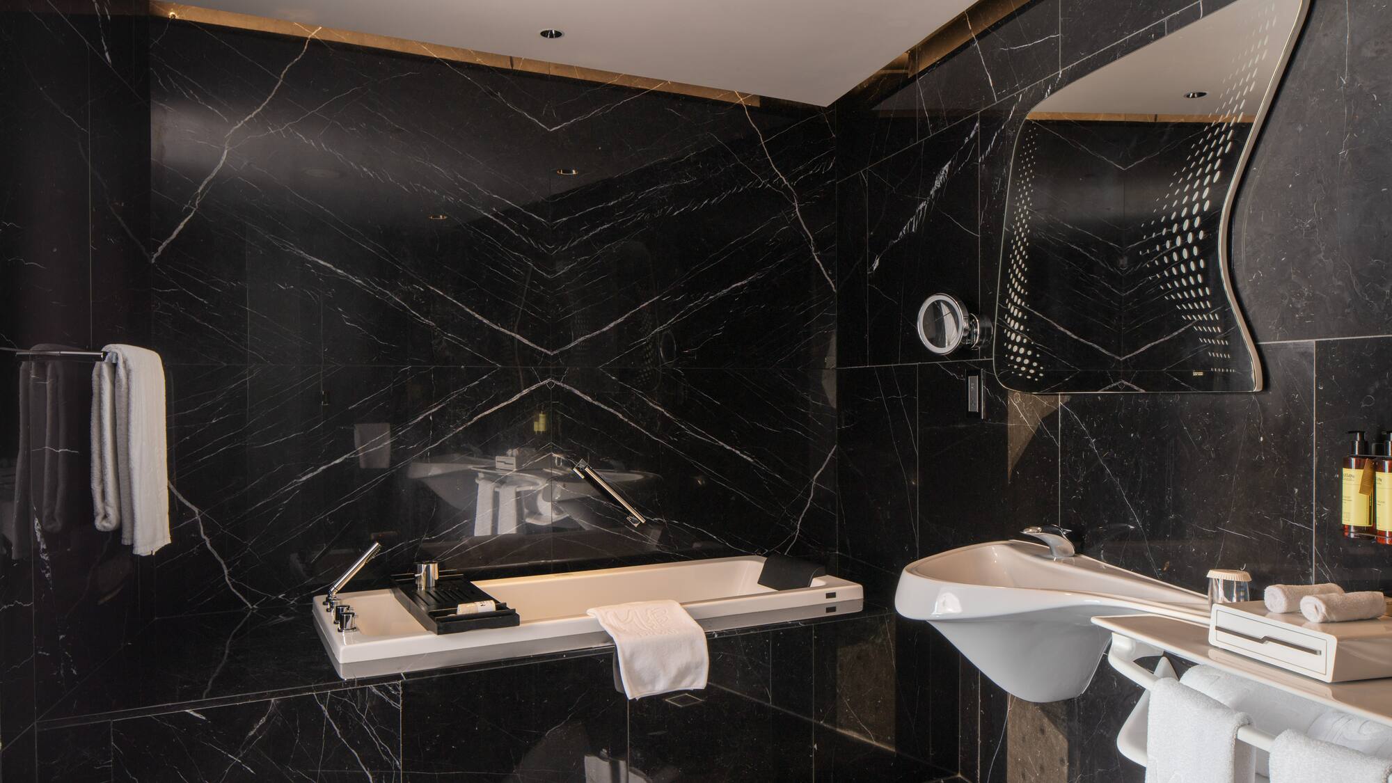 a bathroom with a sink and mirror