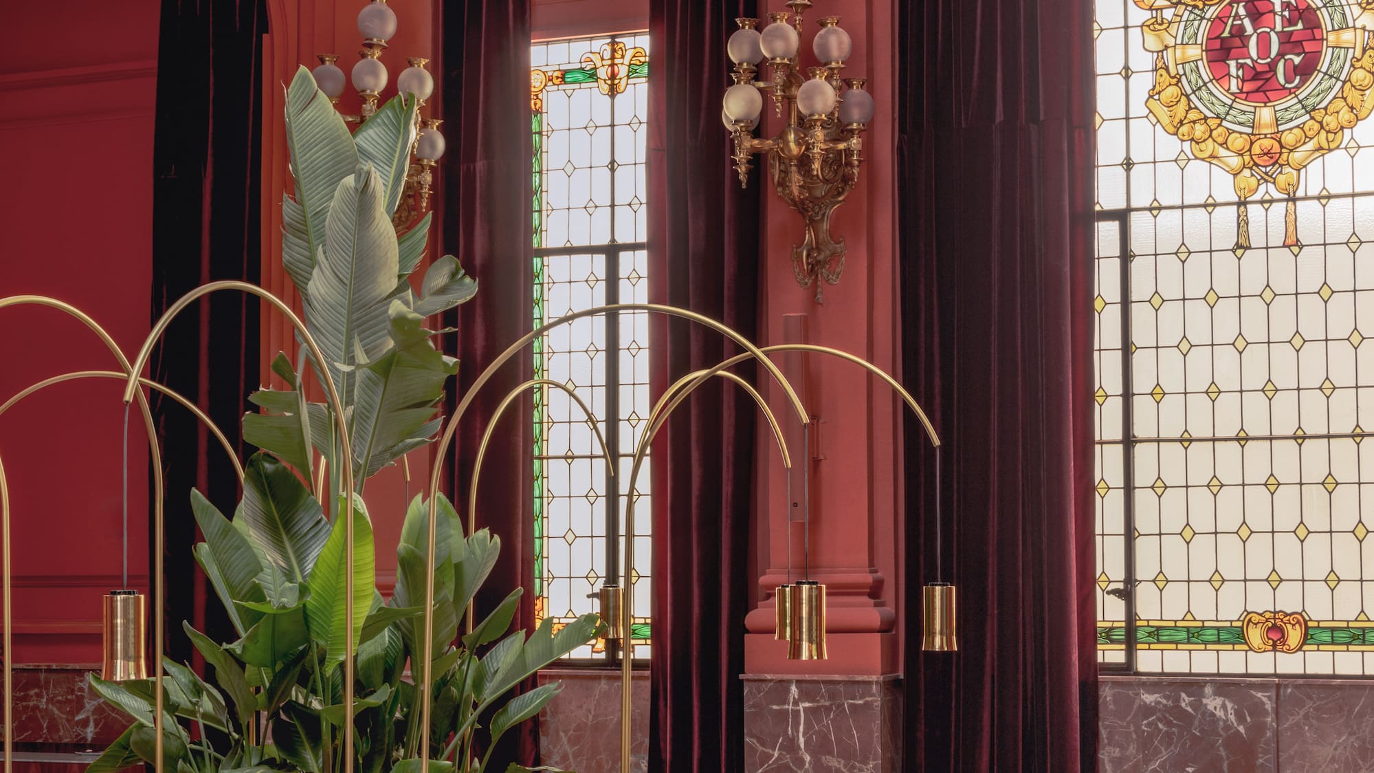 a room with a large window and a plant