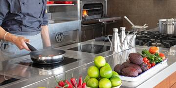 a man cooking in a kitchen
