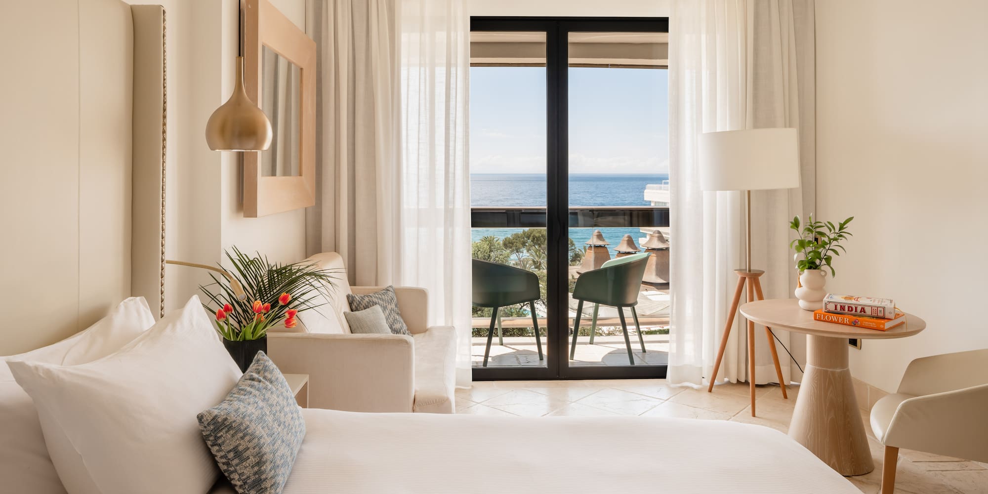 a bedroom with a bed and a couch and a table