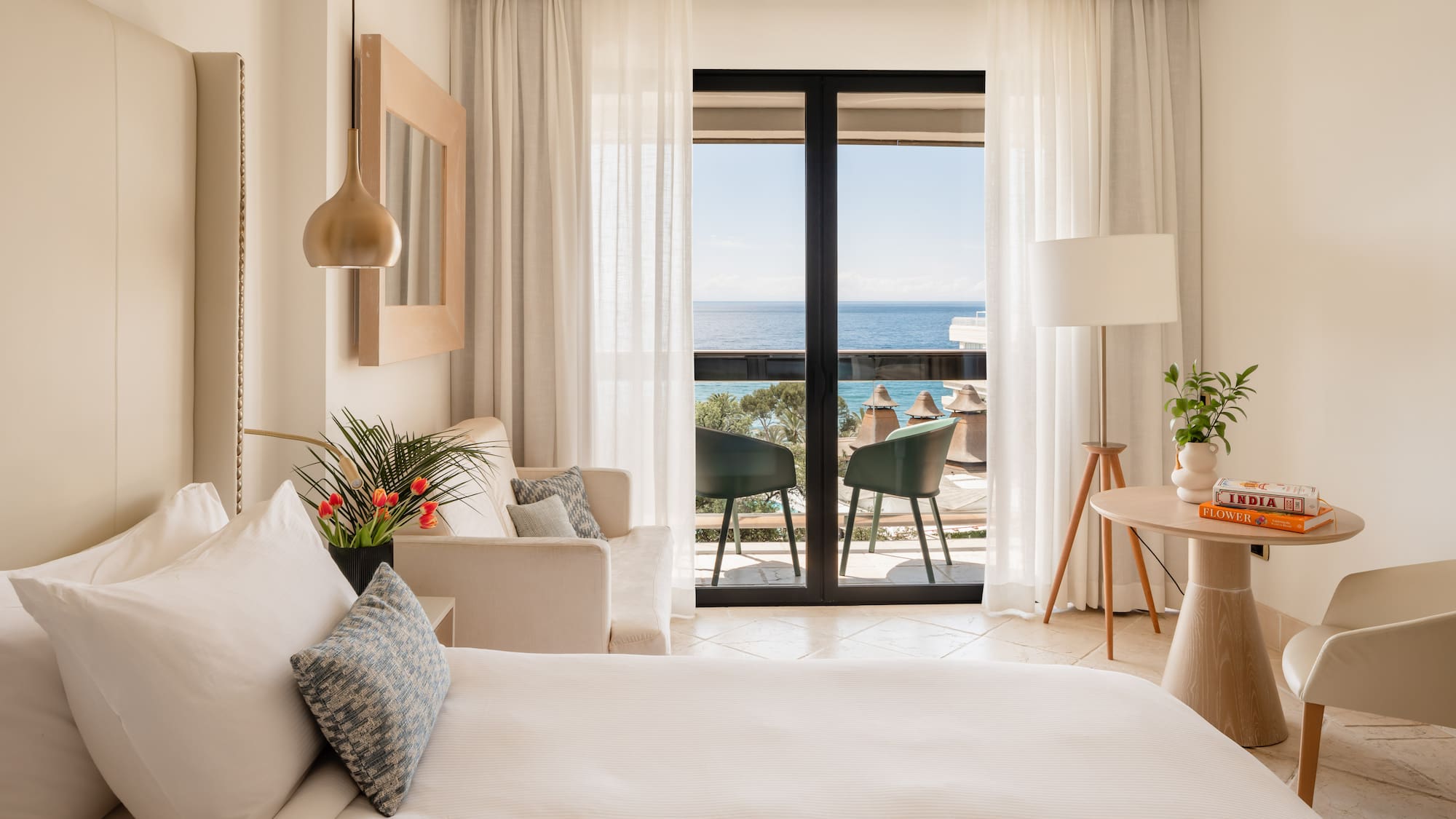 a bedroom with a bed and a couch and a table