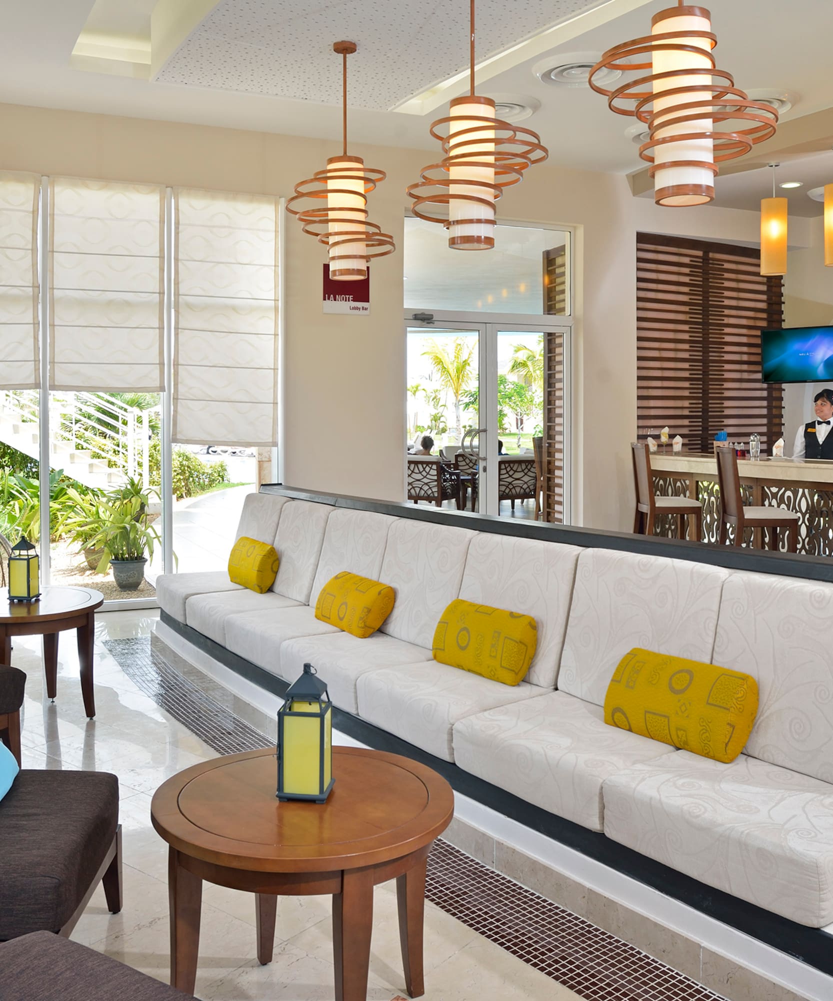 a room with a couch and tables