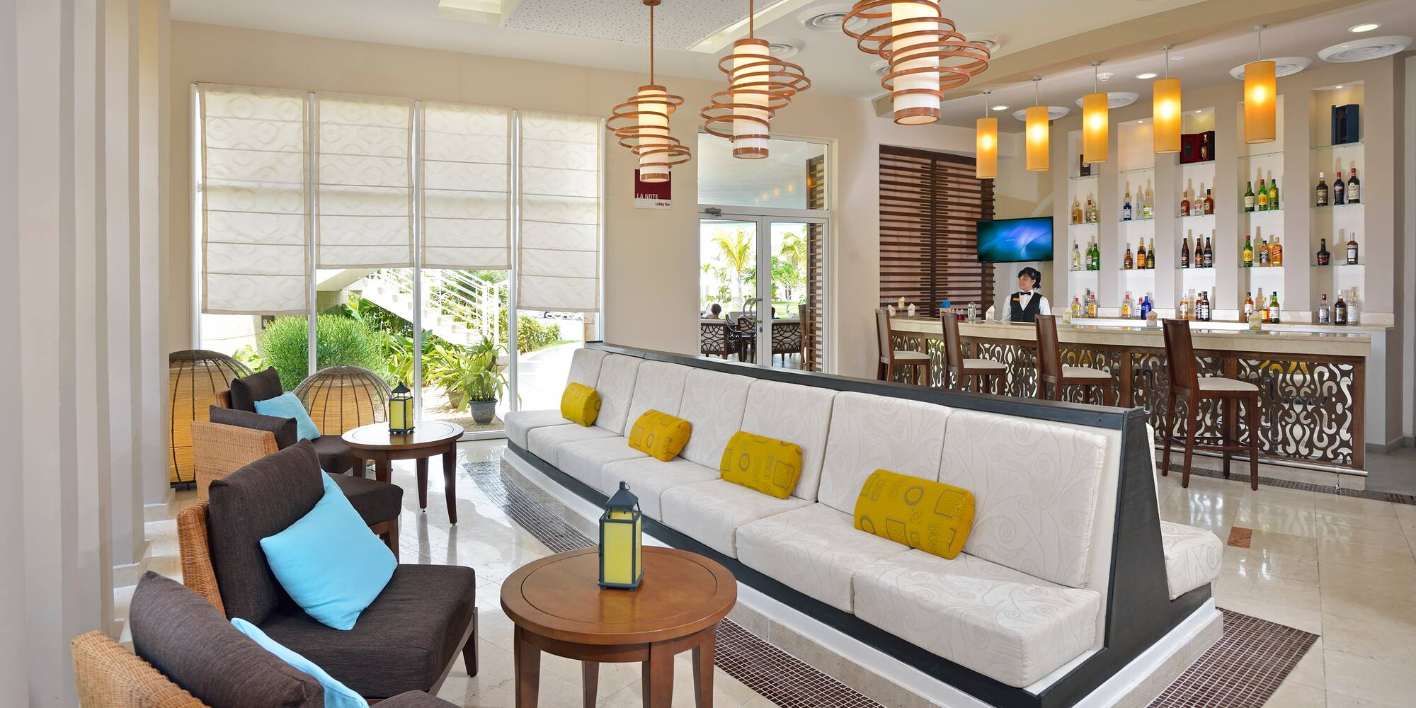 a room with a couch and tables