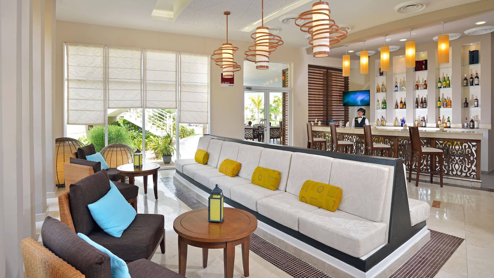 a room with a couch and tables