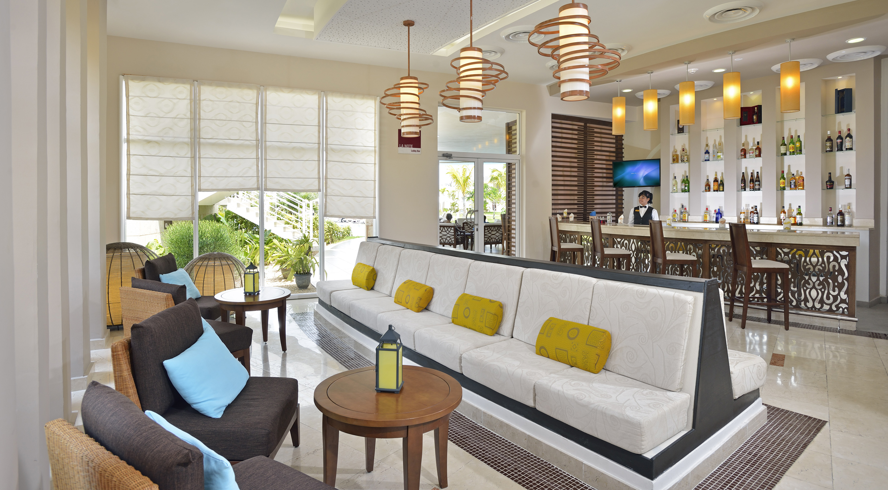 a room with a couch and tables