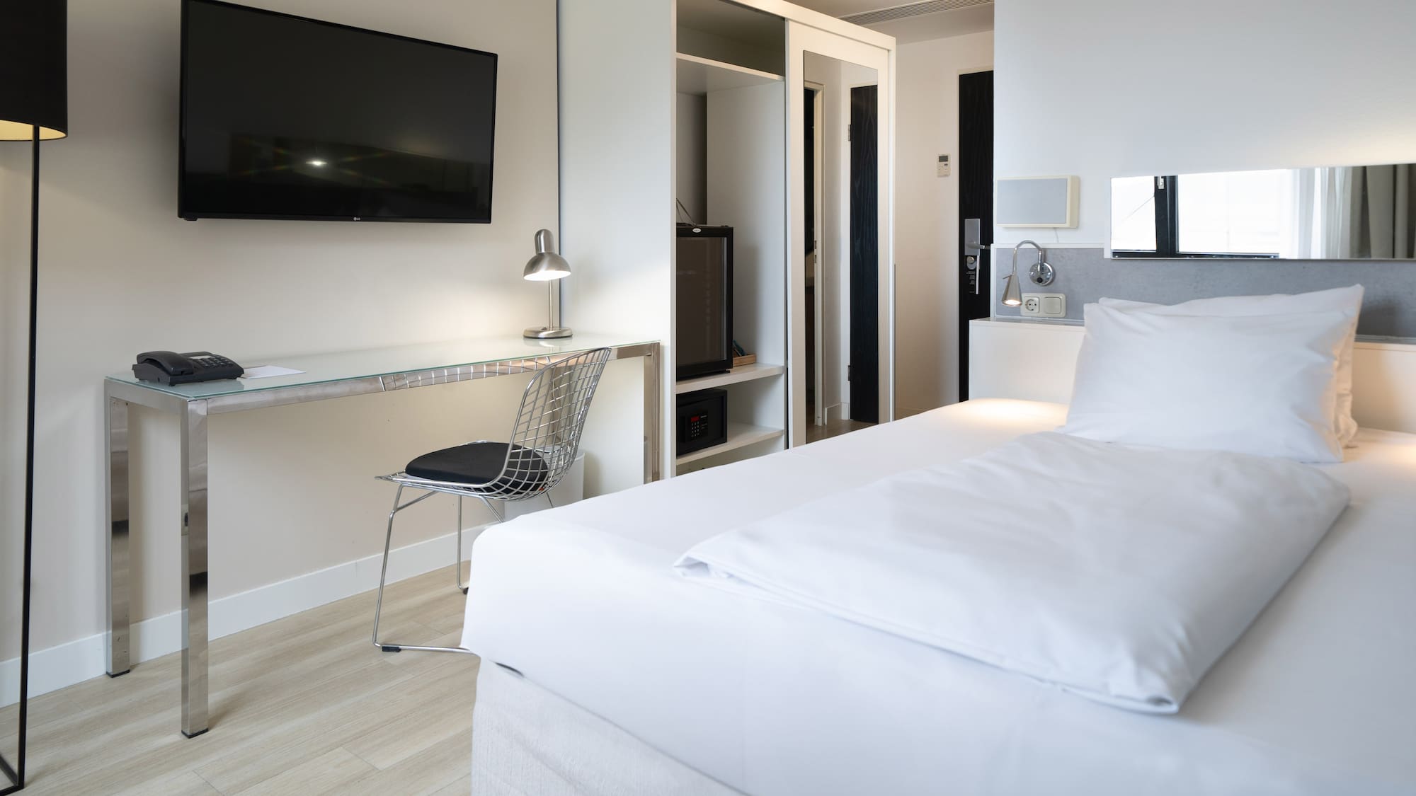 a room with a bed and a desk