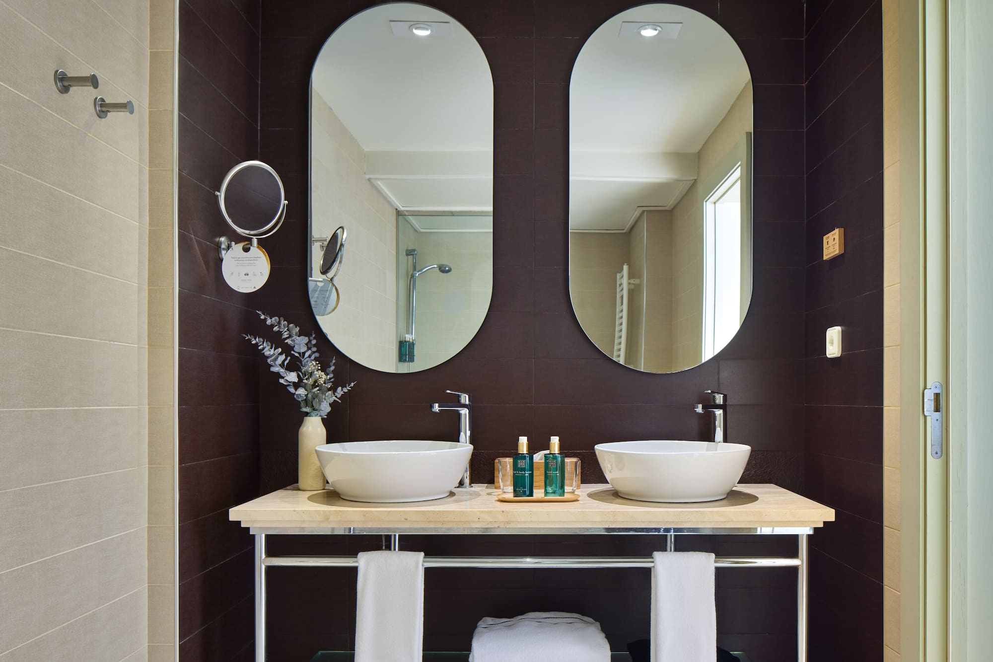 a bathroom with two sinks and mirrors