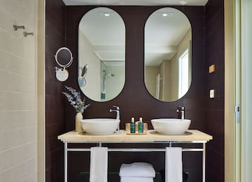 a bathroom with two sinks and mirrors