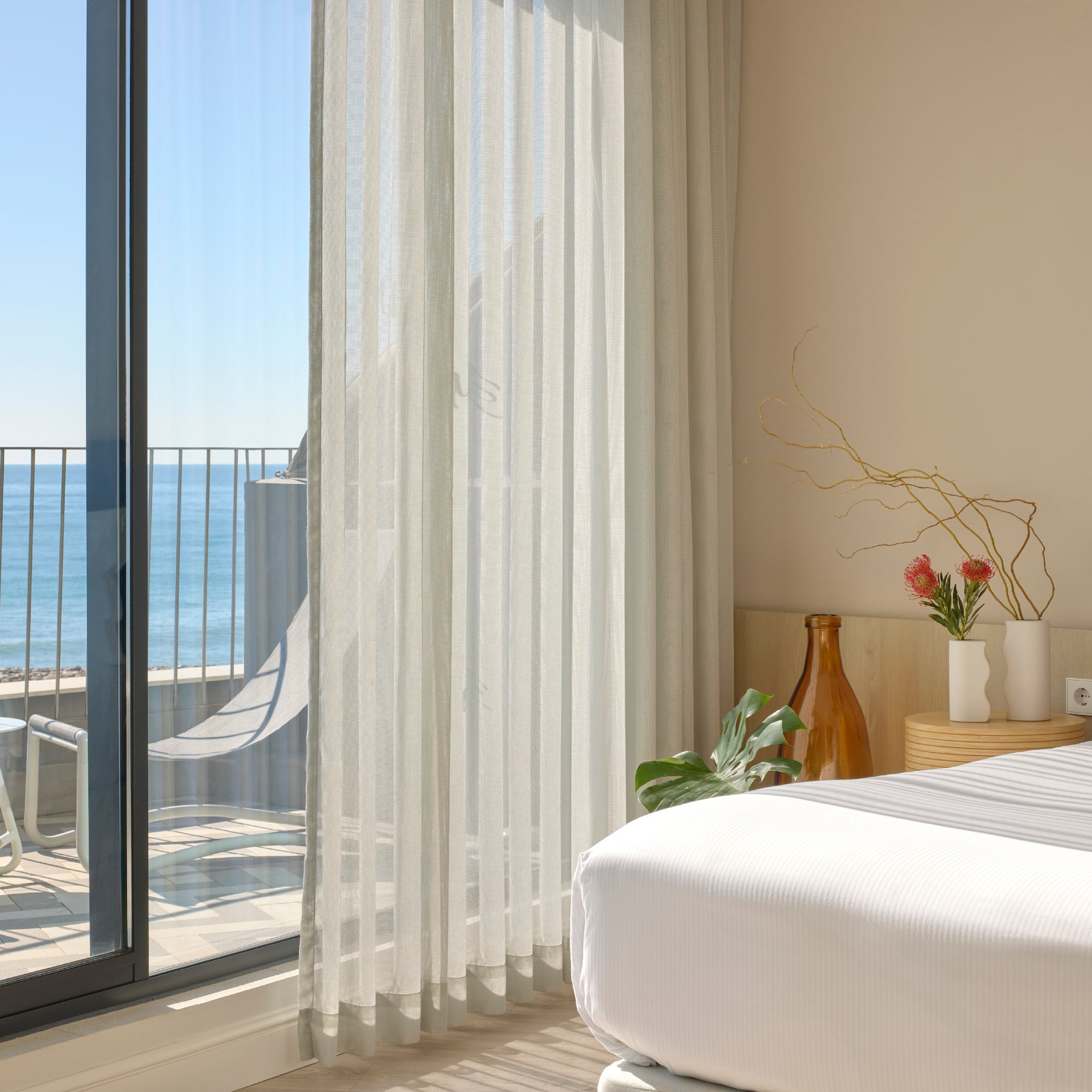 a room with a bed and a glass door