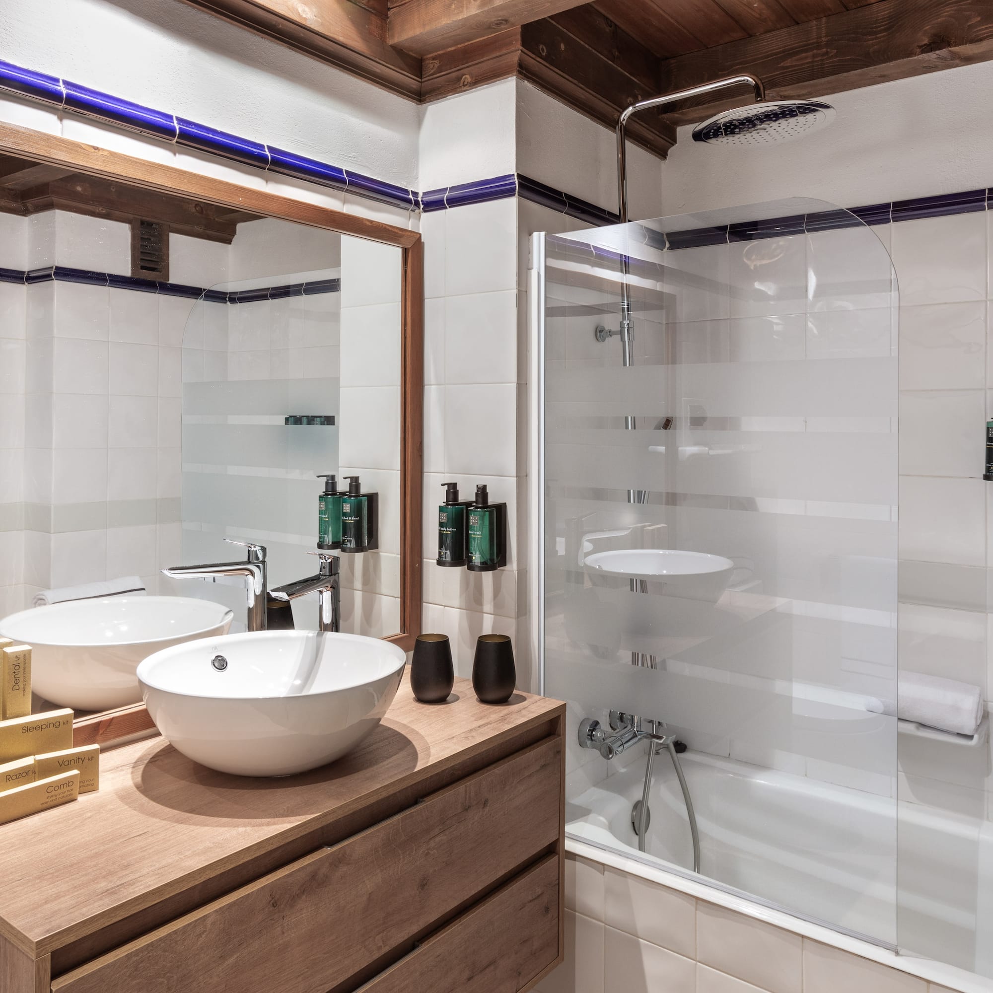 a bathroom with a shower and sink