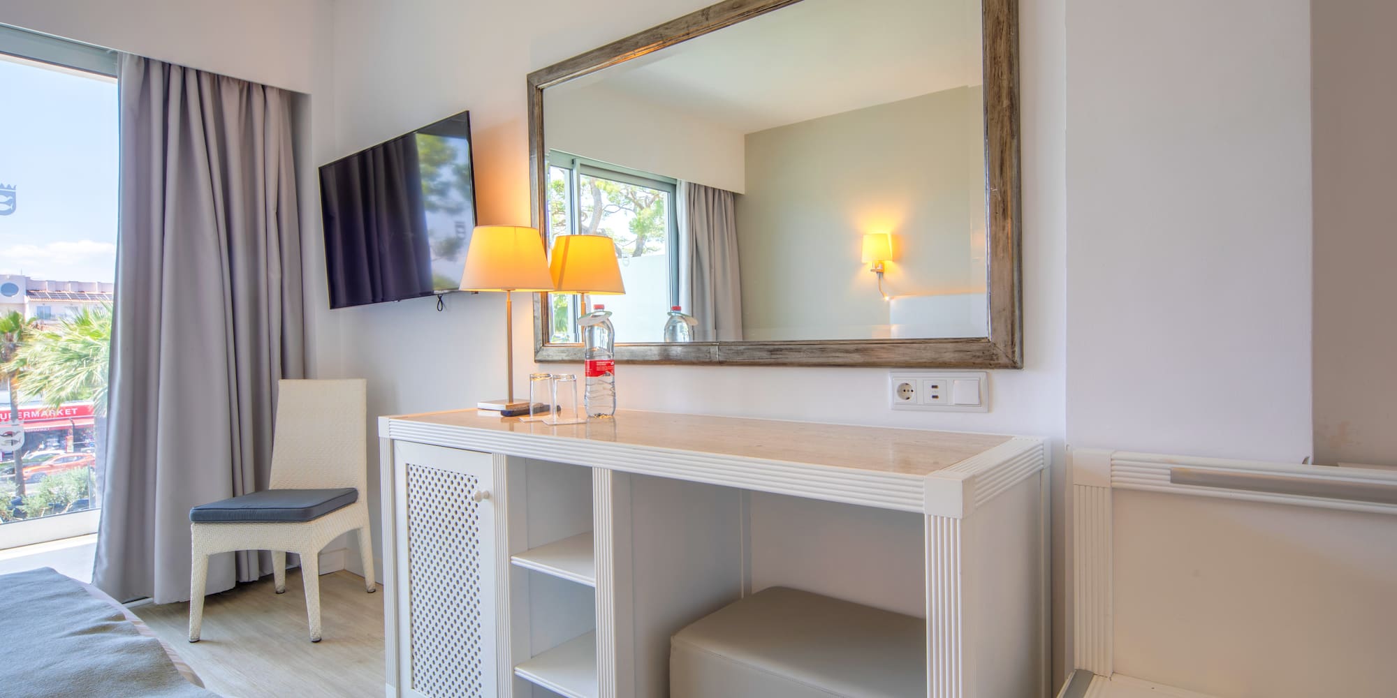 a mirror above a table