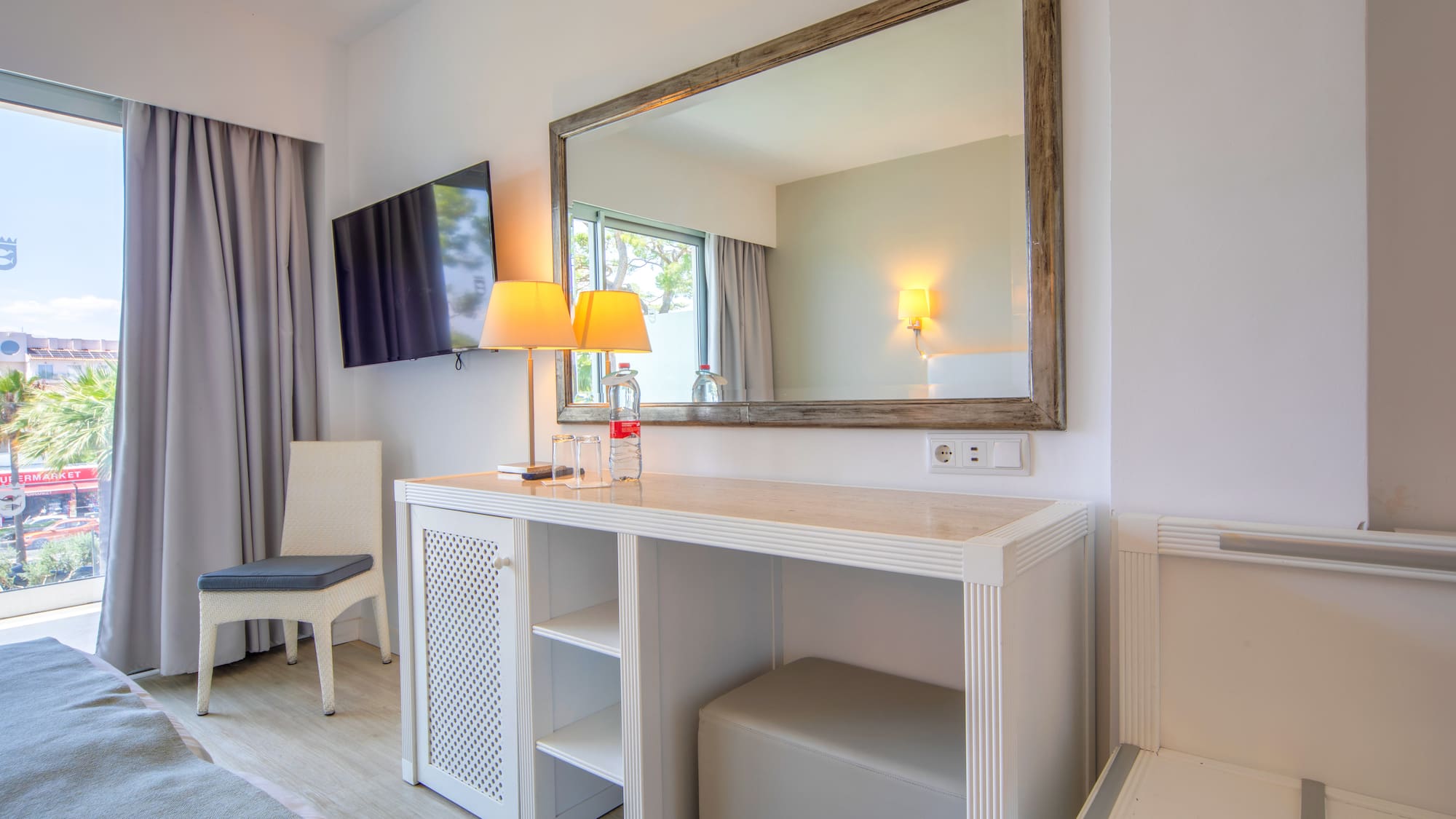 a mirror above a table