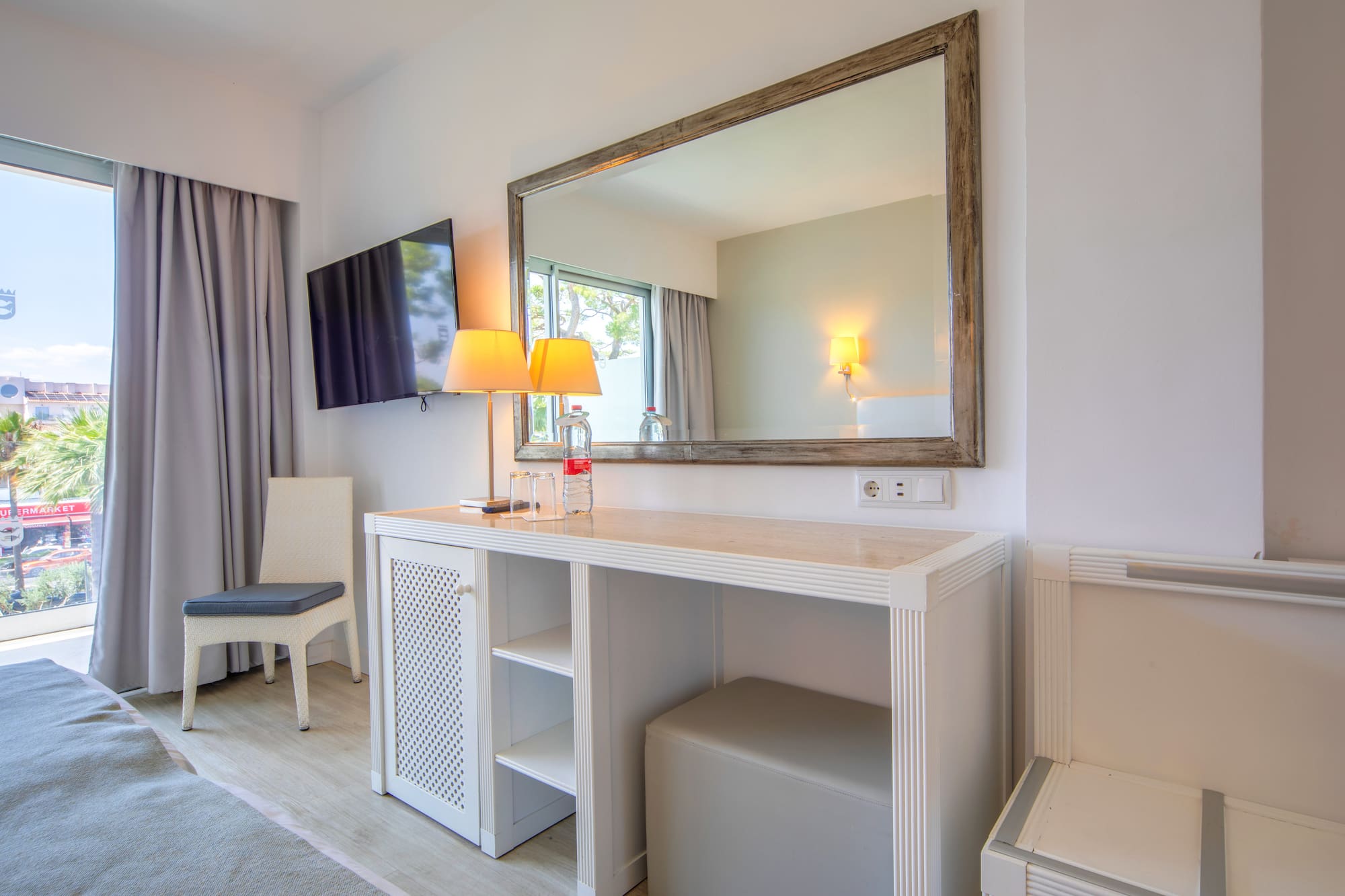 a mirror above a table