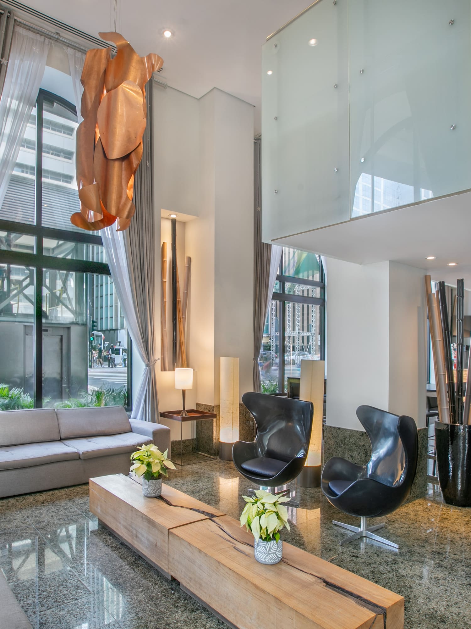 a room with a couch and chairs