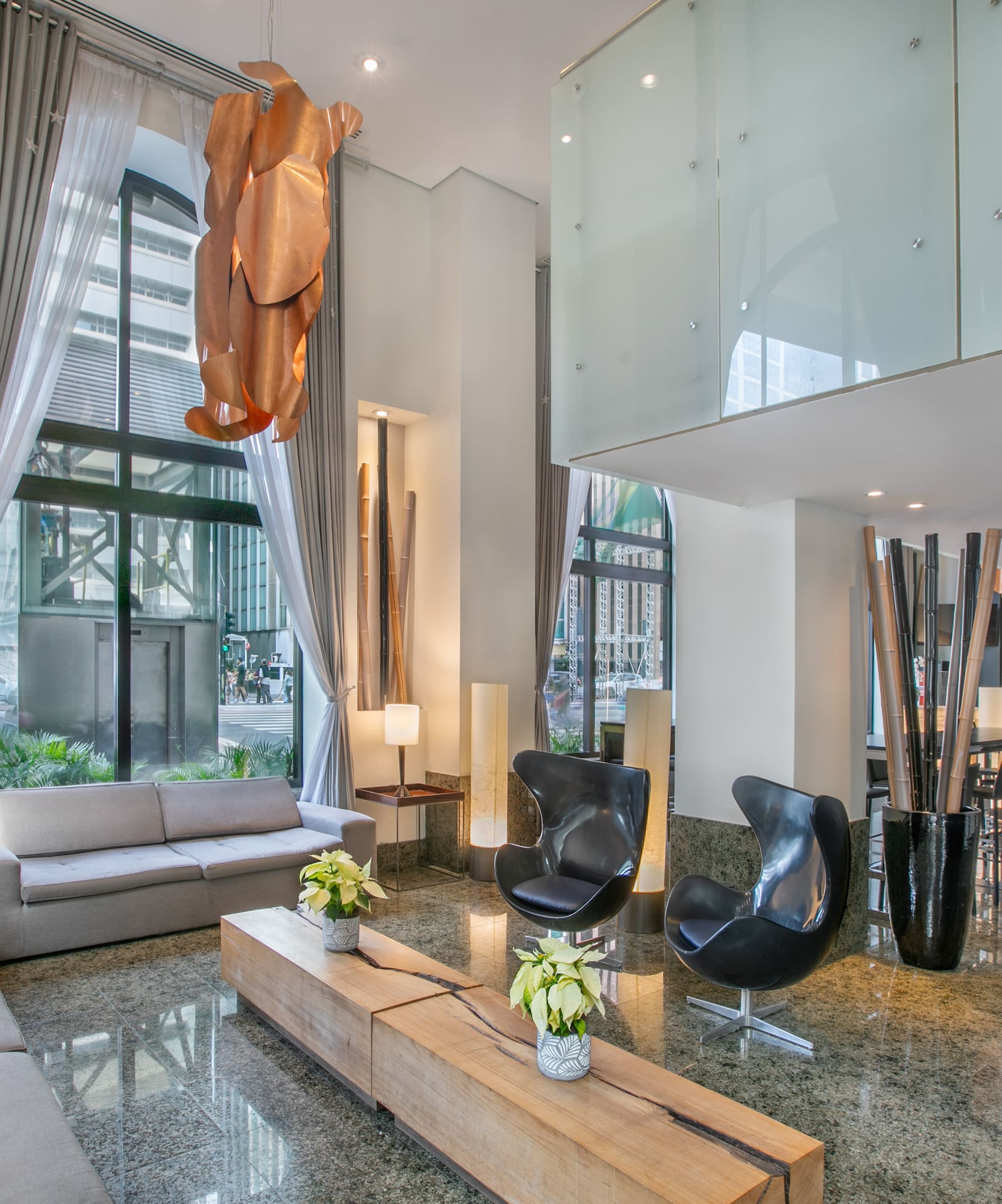 a room with a couch and chairs