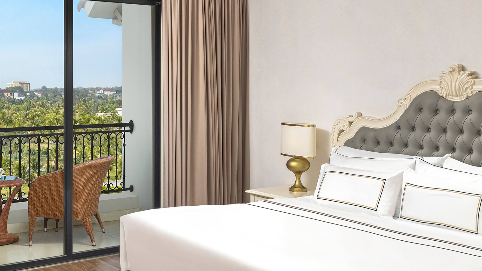 a bedroom with a glass door and a balcony