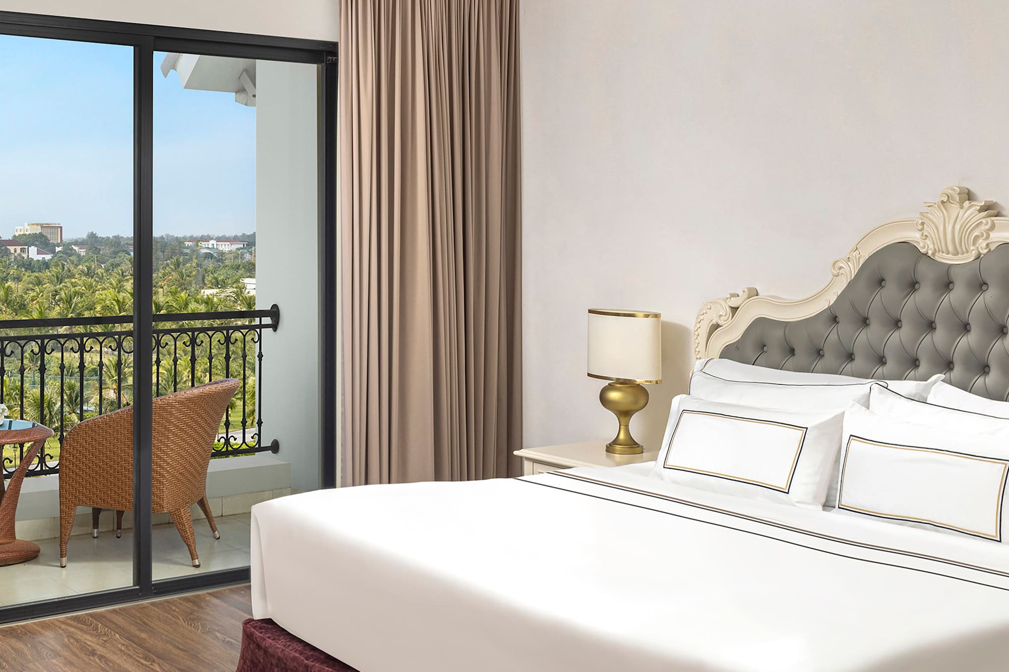 a bedroom with a glass door and a balcony