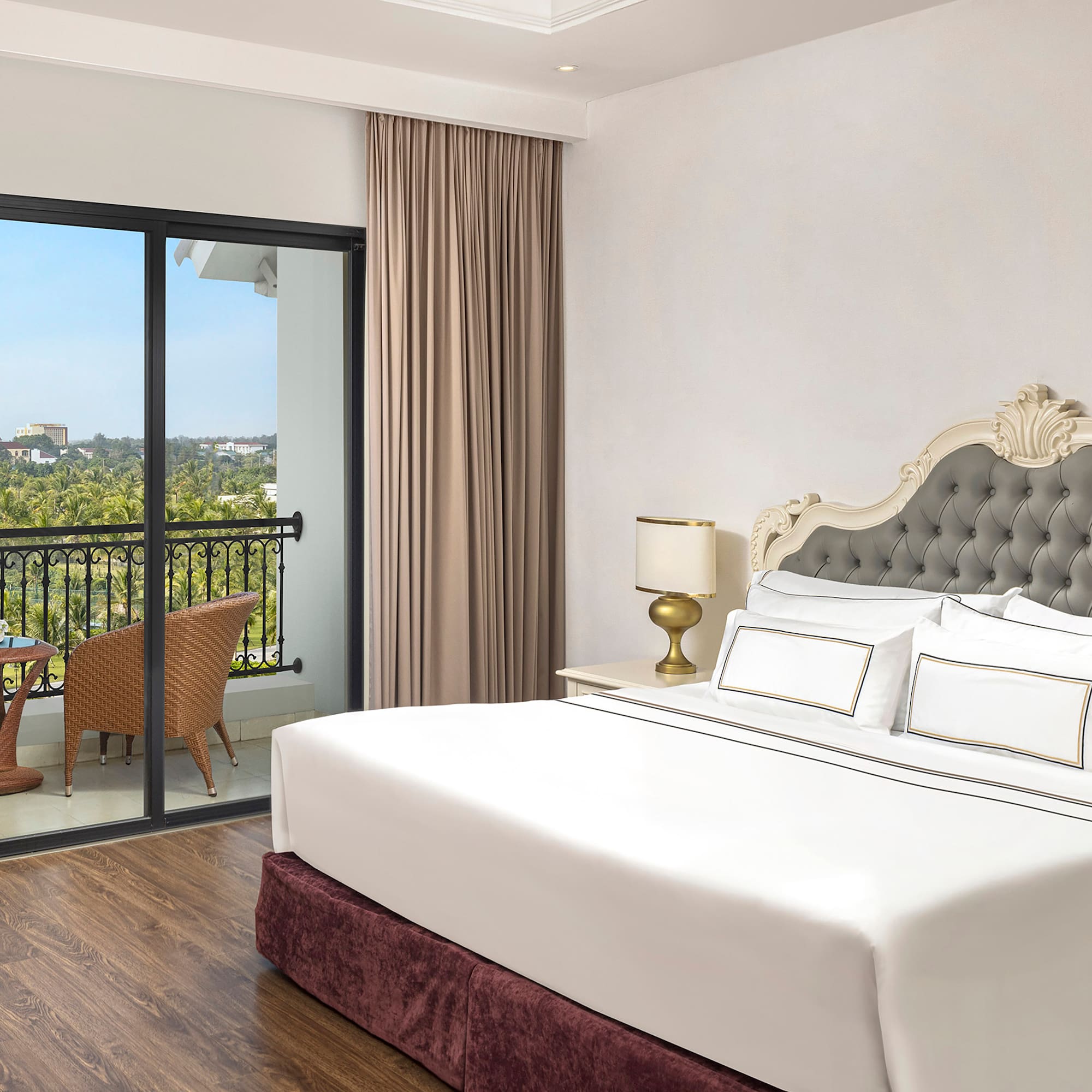 a bedroom with a glass door and a balcony