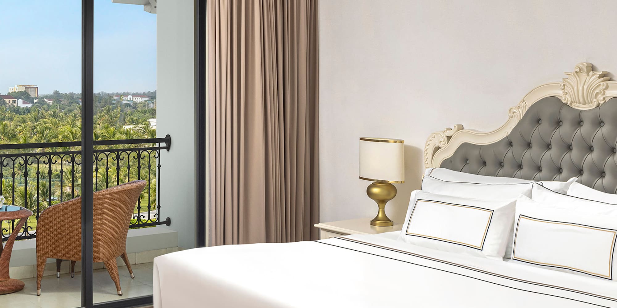 a bedroom with a glass door and a balcony