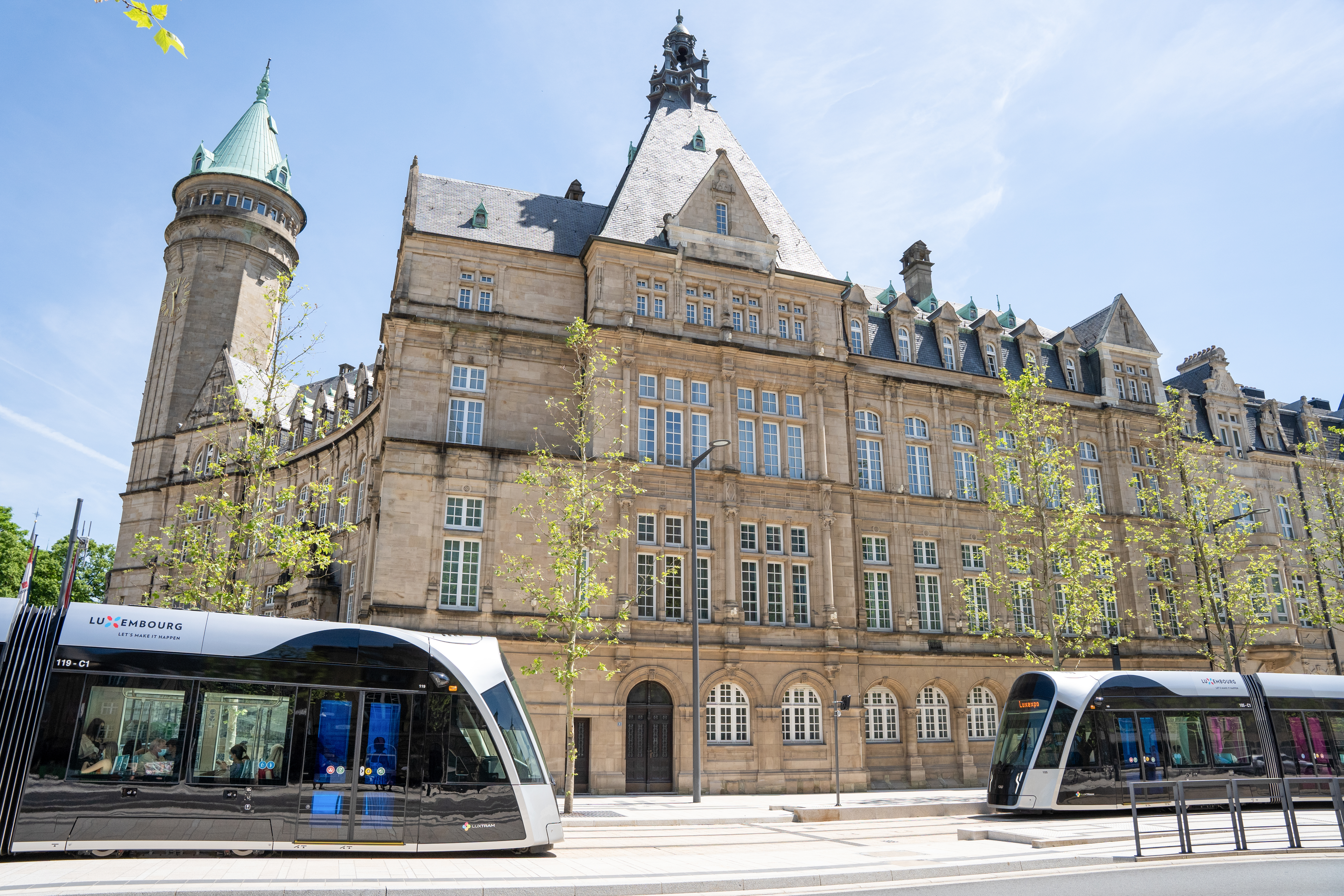 a two buses parked next to a building