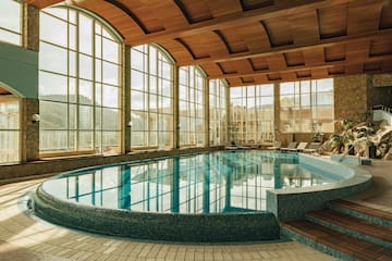 a large indoor pool with a large window