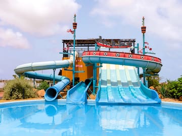 a water park with a pool and a slide