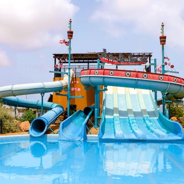 a water park with a pool and a slide