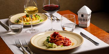 a plate of food and wine glasses on a table