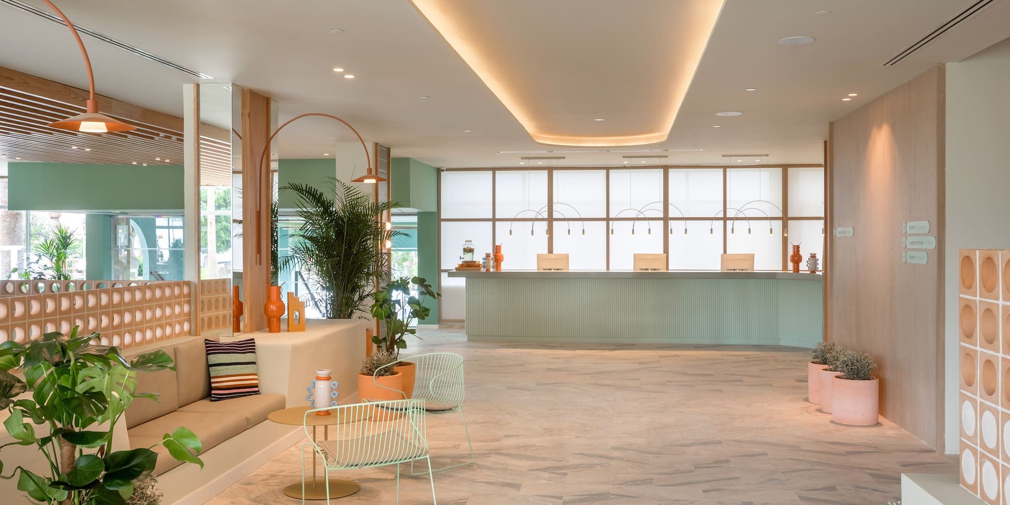 a lobby with a couch and chairs