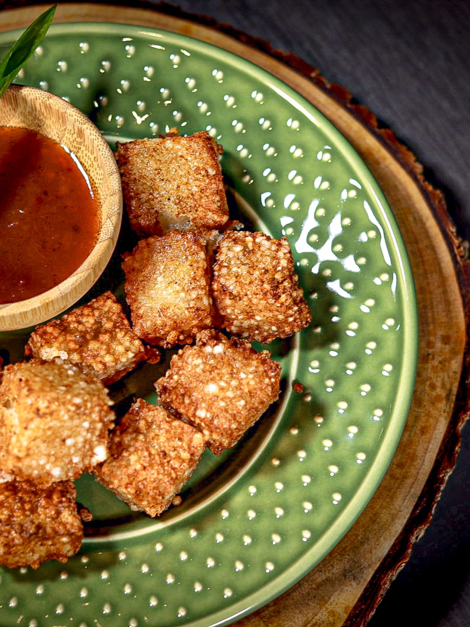 a plate of food with a bowl of sauce