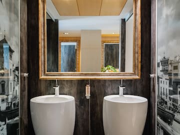 a bathroom with two sinks and a mirror