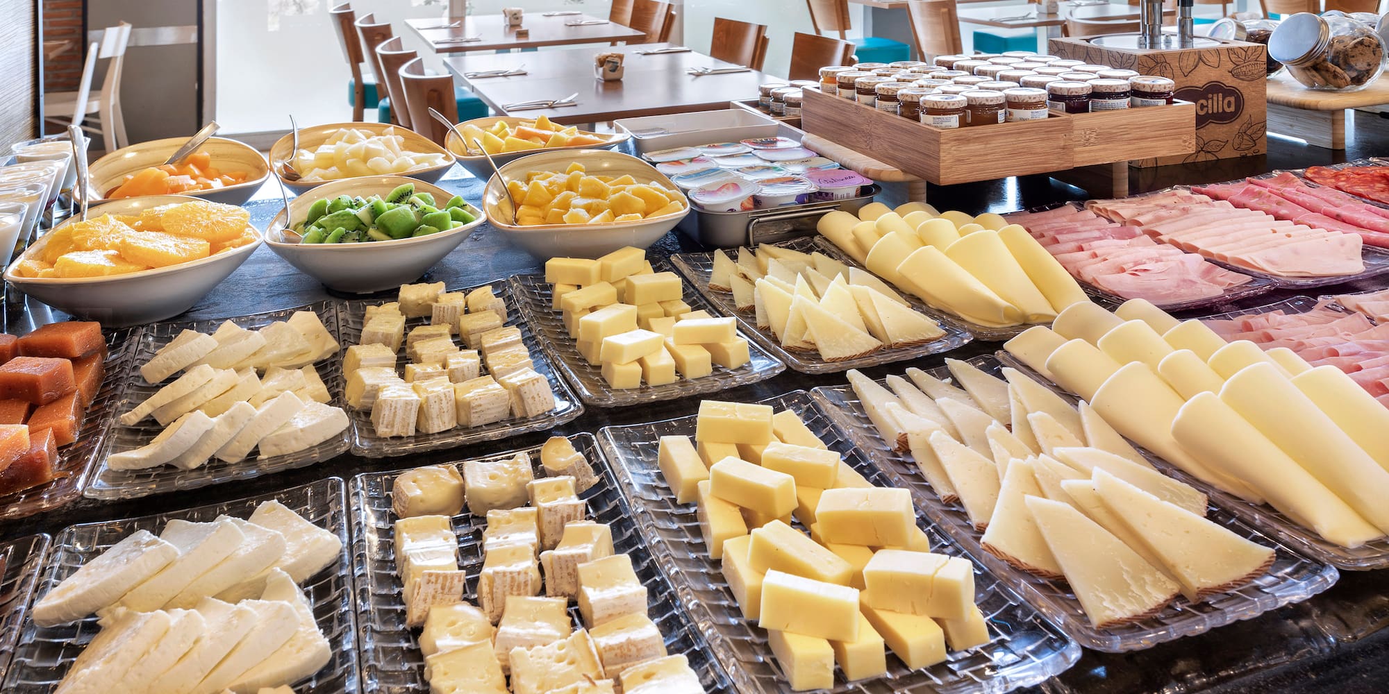 a table full of different types of cheese