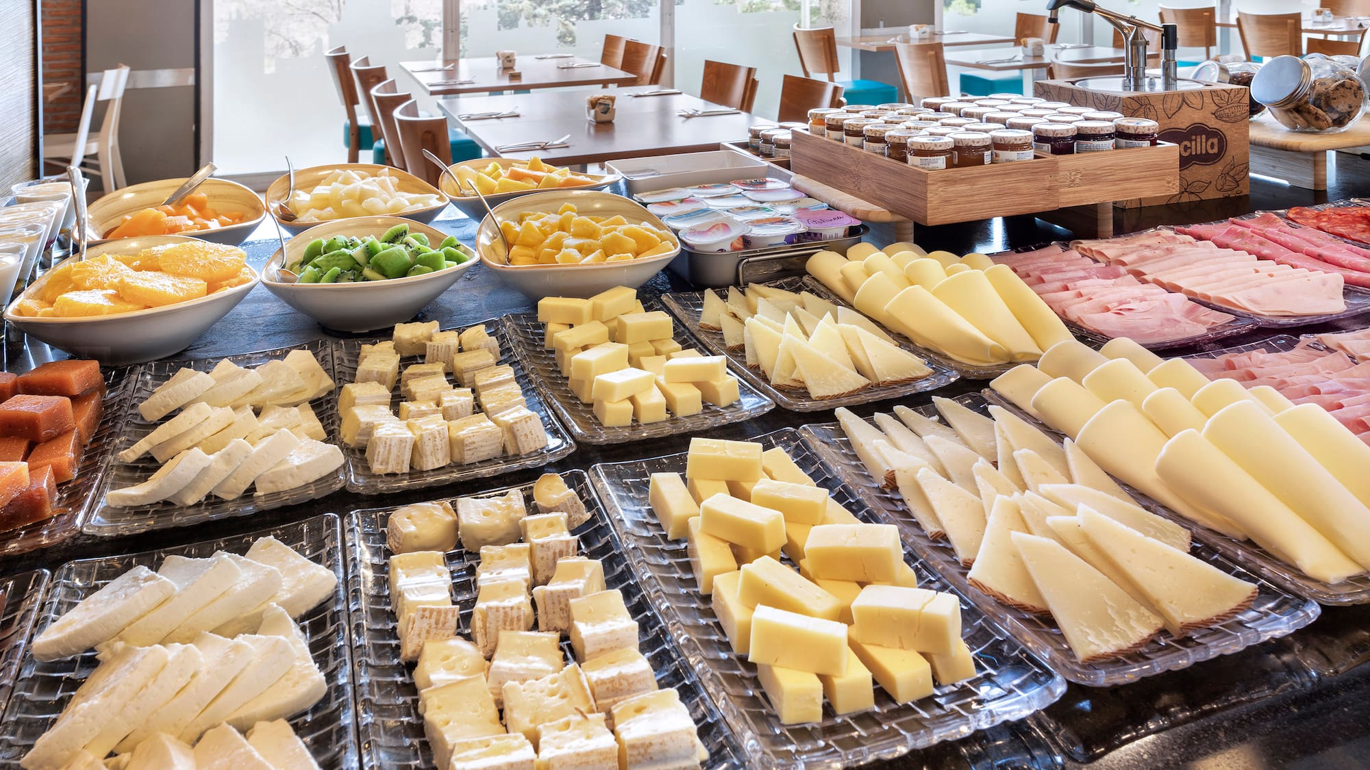 a table full of different types of cheese