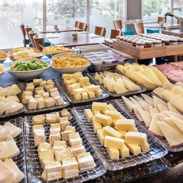 a table full of different types of cheese