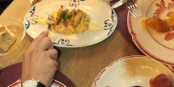 a person eating food at a table